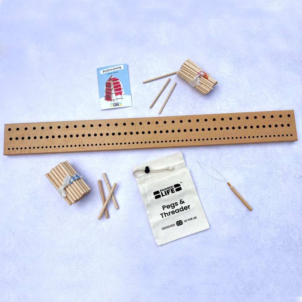 Handcrafted Ragged Life wooden peg loom with evenly spaced pegs, ideal for weaving projects and DIY crafts