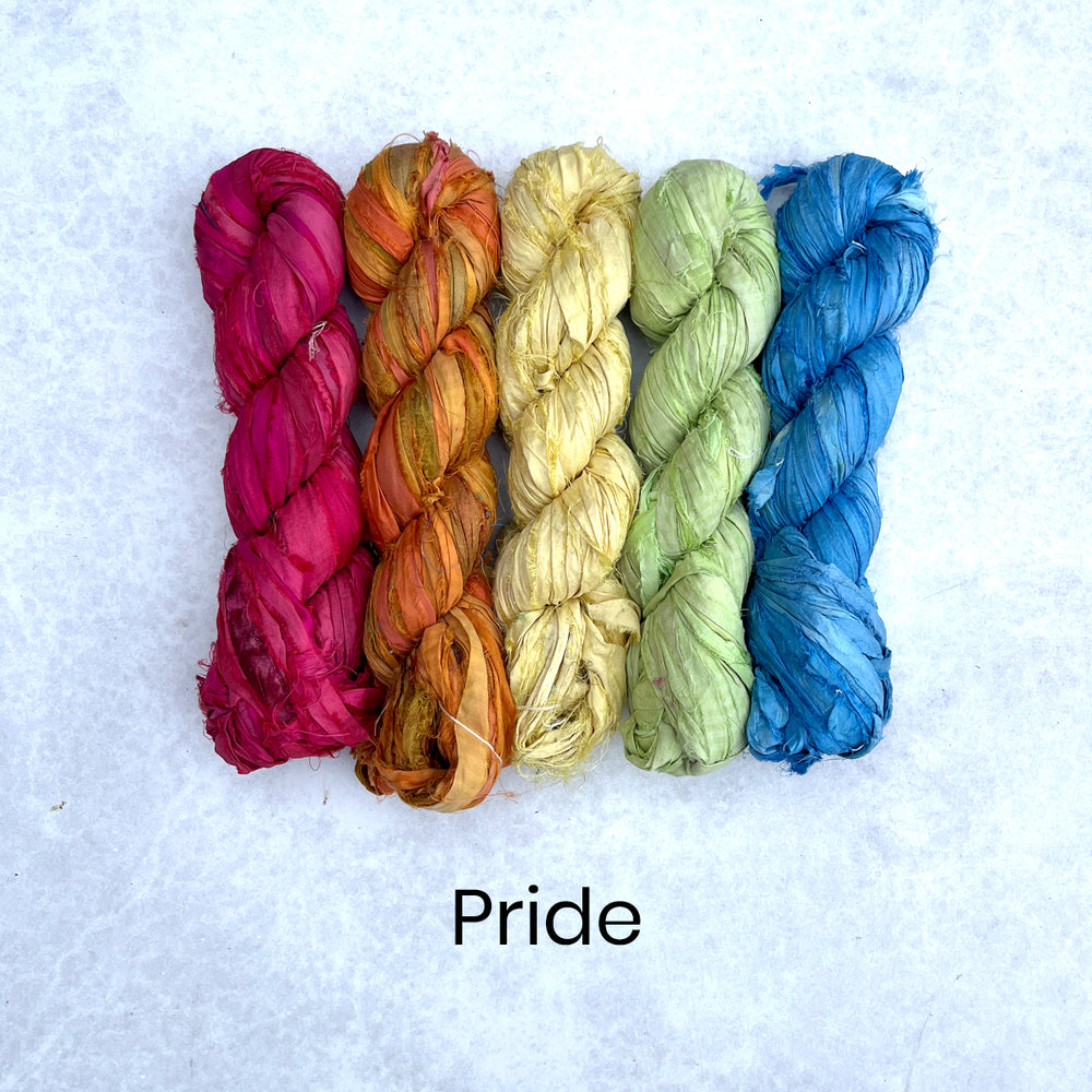 Bright, rainbow selection of 100g sari silk skeins in red, orange, yellow, green and blue colours