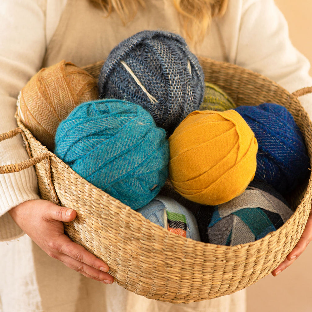 Elspeth Jackson holding colourful balls o blanket selvedges 