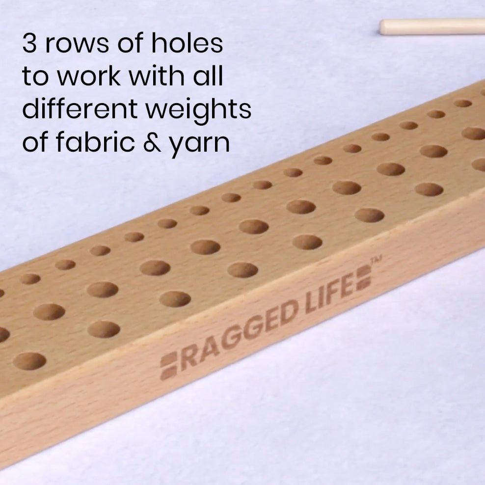 Ragged Life peg loom with three rows of holes to work with fabric strips, raw fleece, yarn and wool