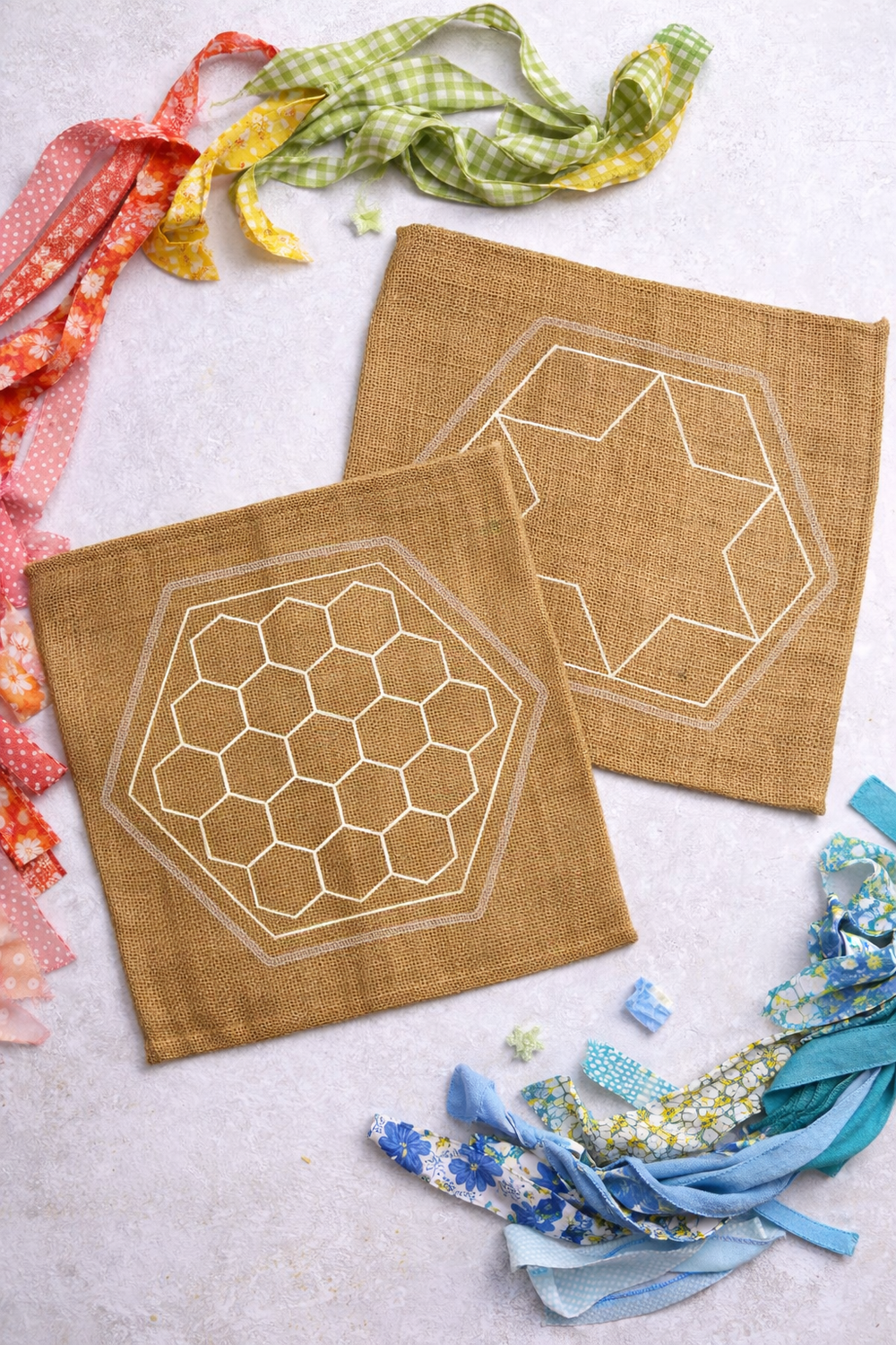 Hemmed hessian squares with hexagon and star patterns on for Ragged Life community rag rug project 