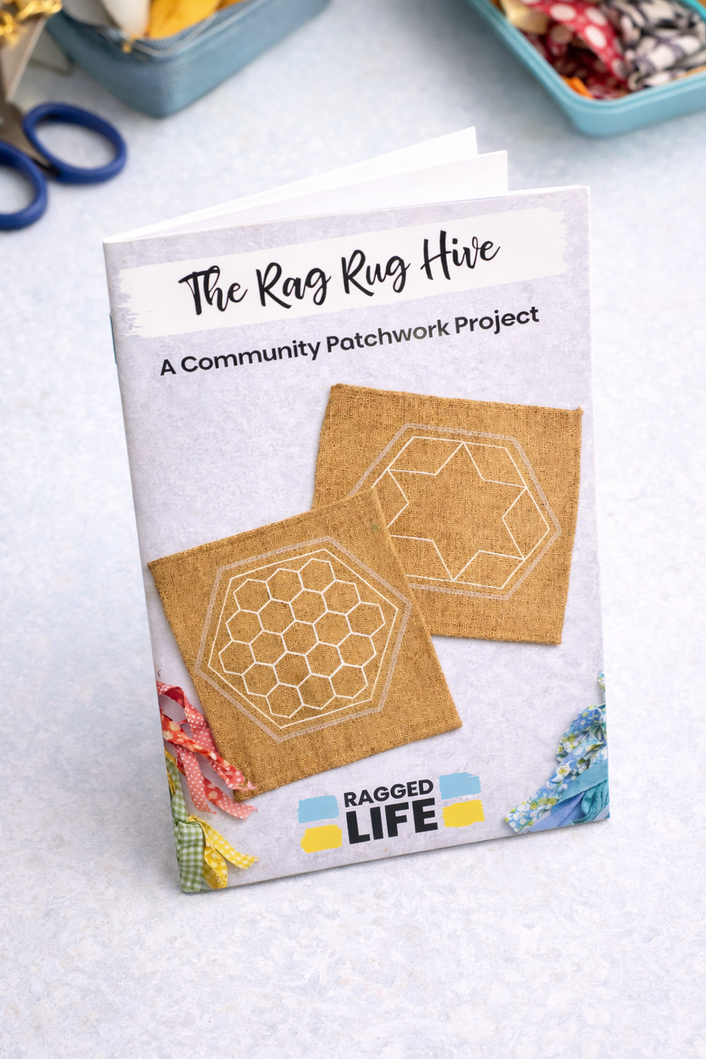 Instruction booklet for 'The Rag Rug Hive' community patchwork project on a light background.