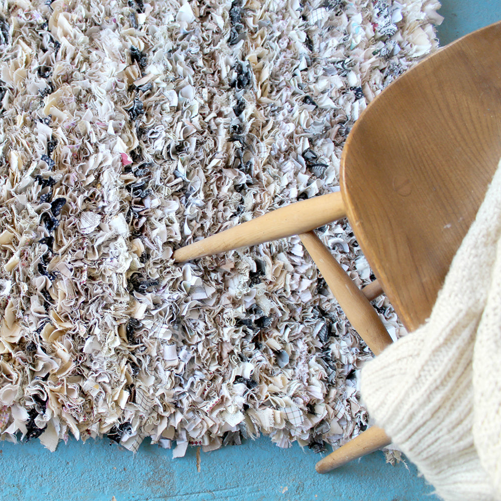 Cream shaggy rag rug in proggy technique