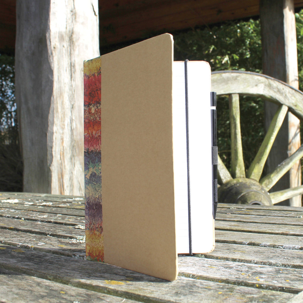 Ragged Life hardback notebook with brown cover and colourful rainbow rag rug image