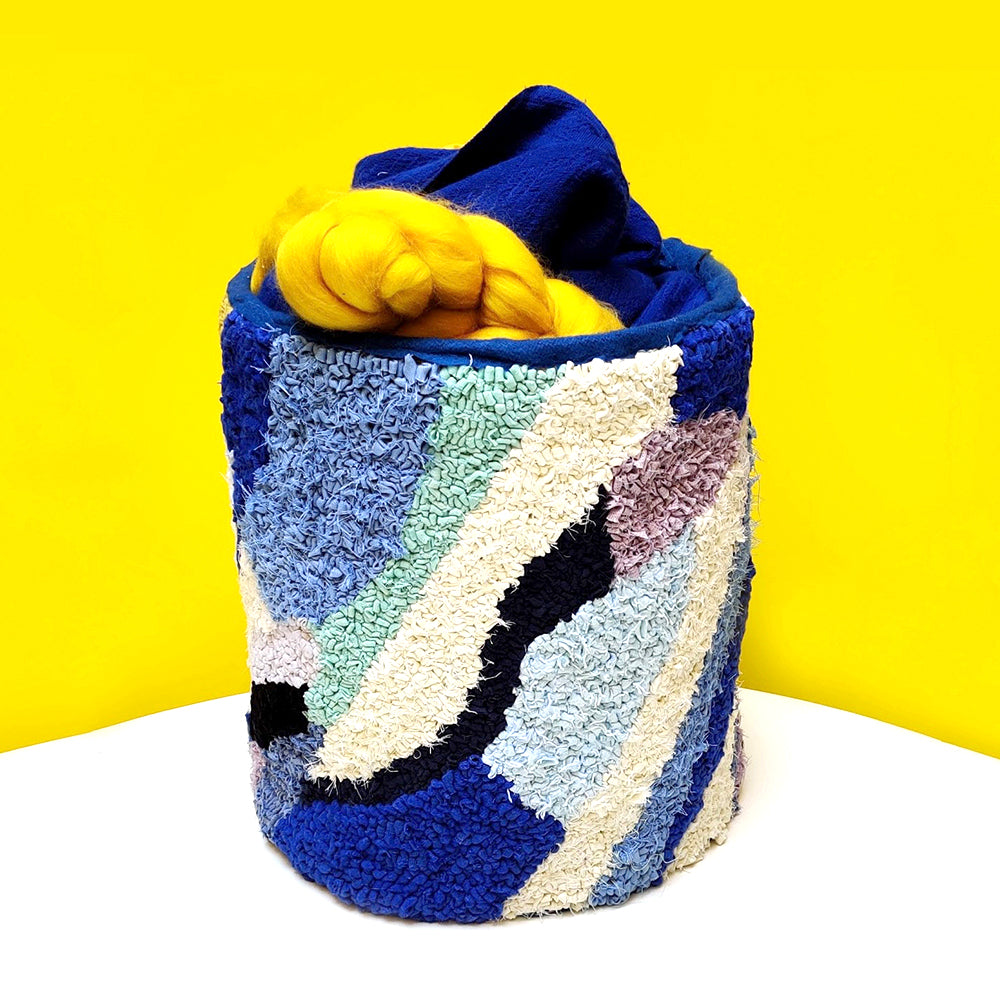 Blue and cream abstract rag rug container
