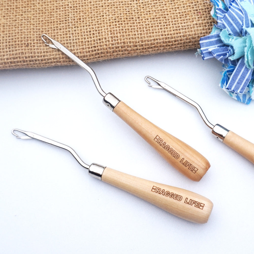 A group of branded wooden handle rag rug latch hooks for rug making